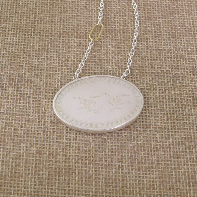 Antique Mother of Pearl Pendant Set in Sterling Silver on a Silver Chain with an 18 Karat Gold Oval