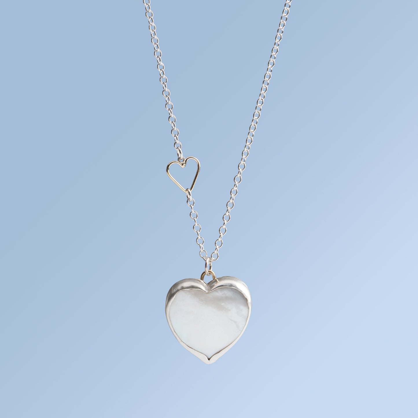 Mother of Pearl Heart Set in Sterling Silver on a Sterling Silver Chain with an 18 Karat Gold Heart Link