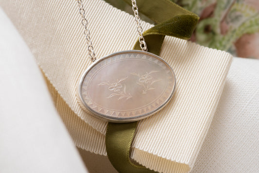 Antique Mother of Pearl Pendant Set in Sterling Silver on a Silver Chain with an 18 Karat Gold Oval